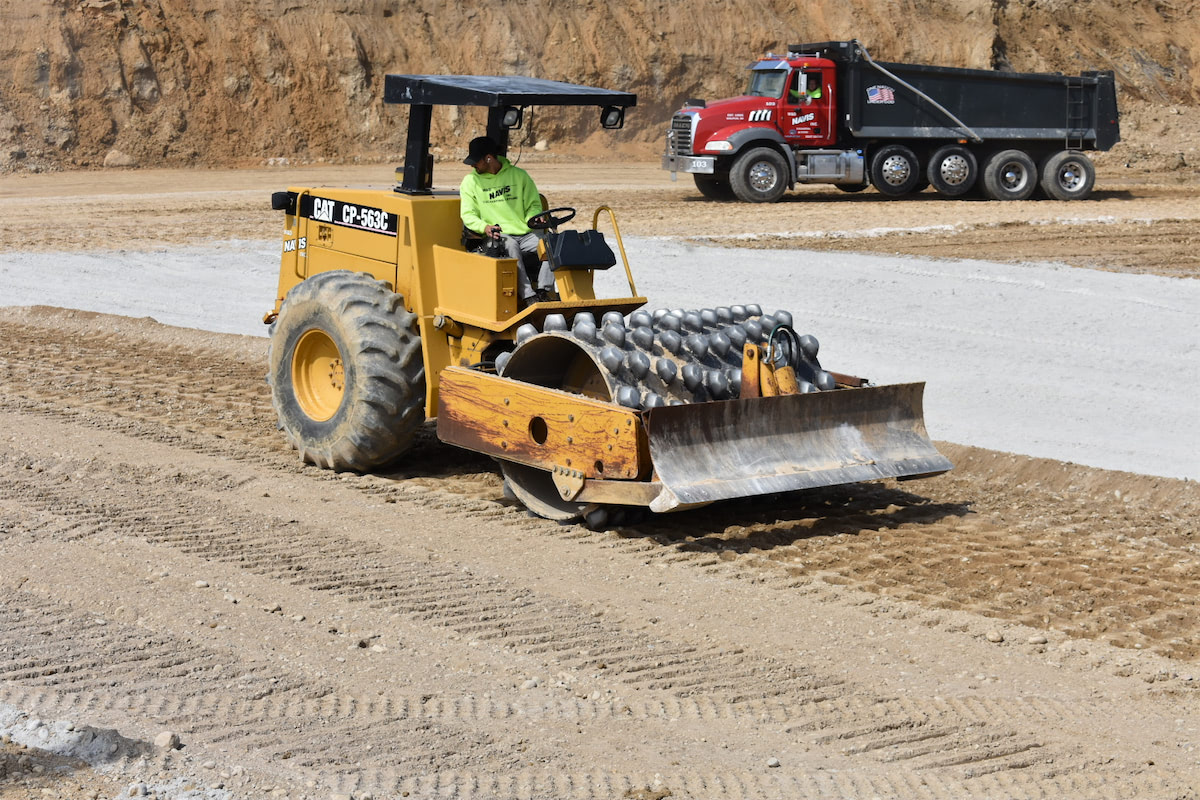 soil being compacted by a bulldozer