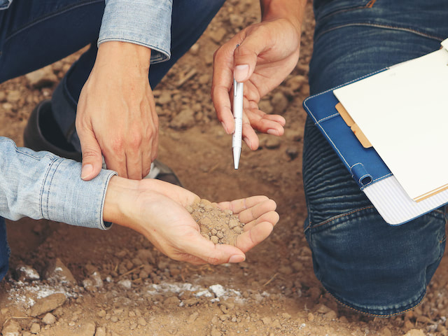 truck spreading soil